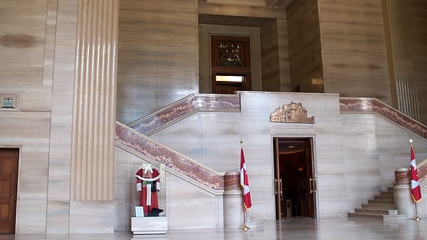 The interior of the Supreme Court building in Ottawa, with the bench and counsel tables seen from the public seating