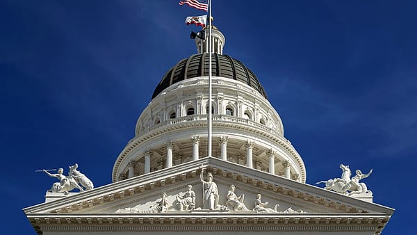 Northwest view up to the pediment, rotunda, and dome of the California State Capitol in Sacramento