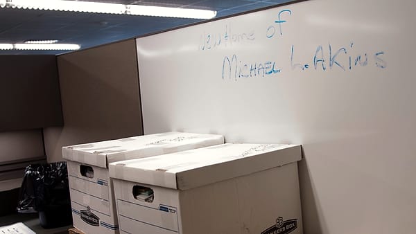 Boxes of files wait for Michael Akins to arrive at his new work station in the Old Bowley School on Fort Bragg, N.C., Monday