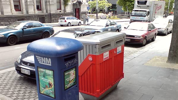 Several mailboxes (New Zealand Post and Universal Mail, a competitors) on Queen Street , Auckland City , New Zealand