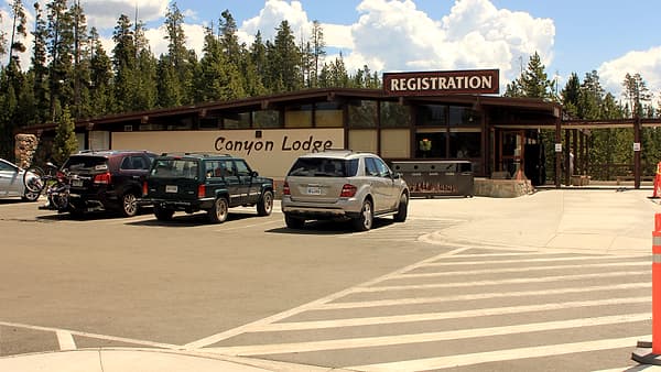 The registration desk at Canyon Lodge, with the counter and signage where arrivals are checked in