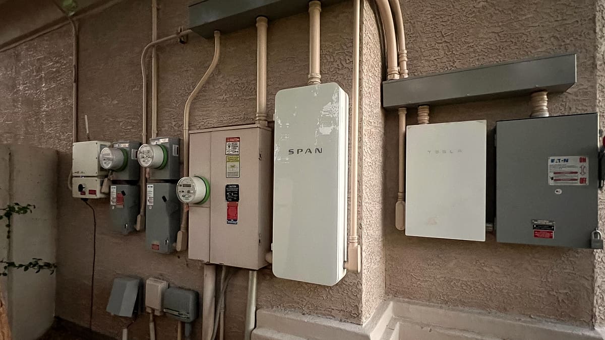 A smart panel (SPAN panel) and multiple meters installed on an electrical service entrance in Phoenix, AZ