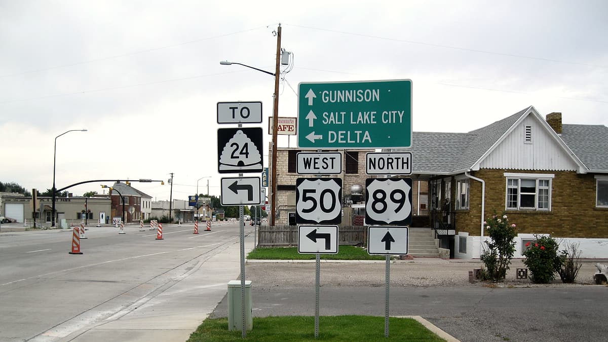A highway sign at the US-89 and US-50 split marking the junction with Utah State Route 24